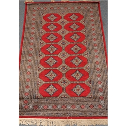  Bokhara red ground rug, repeating border, 190cm x 128cm  