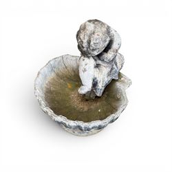 19th century lead bird bath depicting a seated cherub on a shell