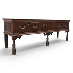 17th century 8’ oak dresser base with moulded front, rectangular top, above four drawers, raised on turned and block support 