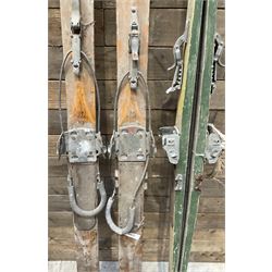 Two pairs of vintage skis, L207cm and 197cm