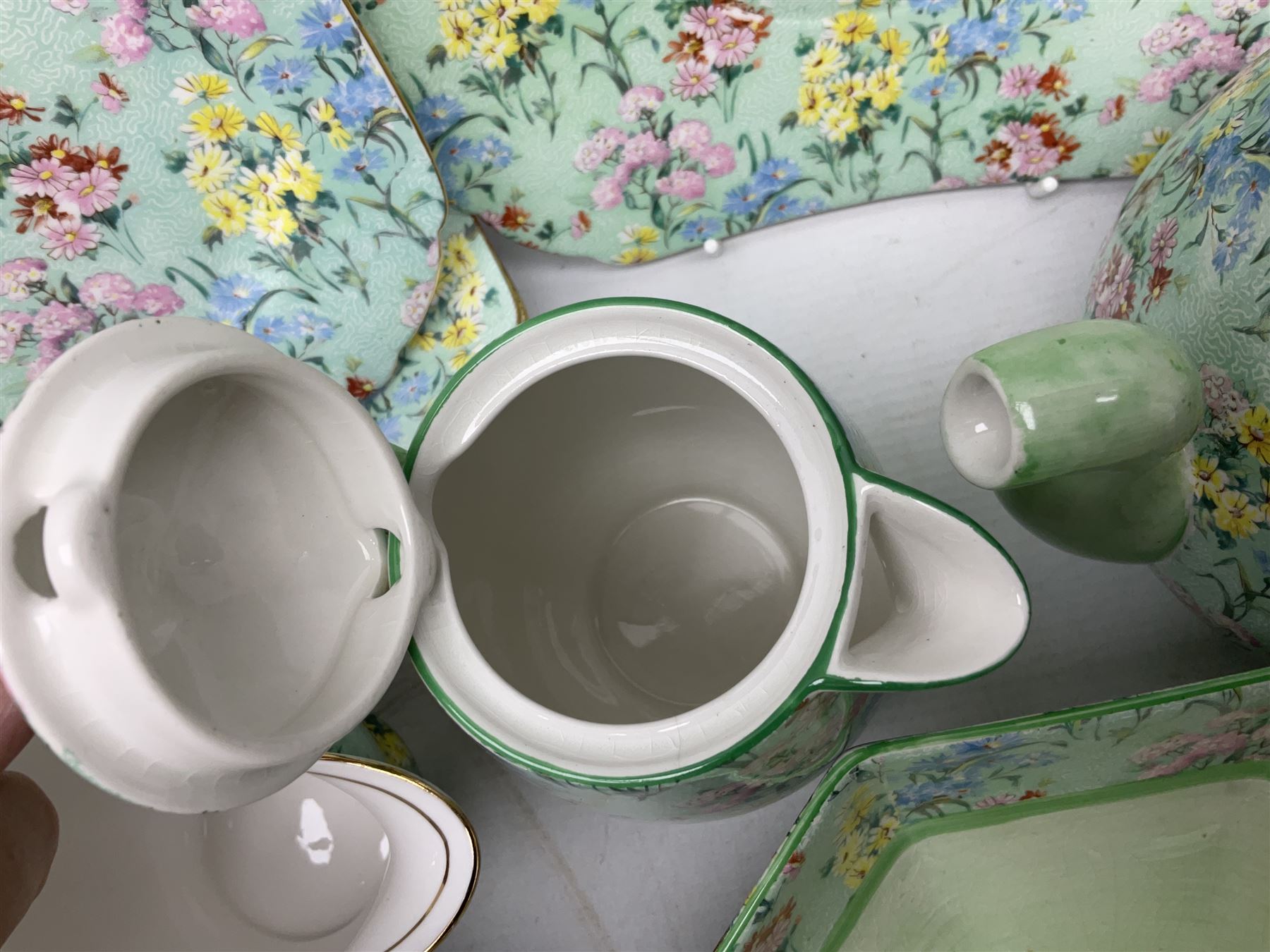 Shelley Melody pattern tea service for six, to include teapot, teapot stand, hot water jug, milk jug, covered sucrier, teacups and saucers, cake plates etc (31)