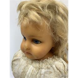 Early 20th century Cuno and Otto Dressel wax shoulder head doll with applied hair and fixed glass eyes, soft body with jointed composition lower limbs, maker's stamp to right thigh, clothing and box H38cm in original box