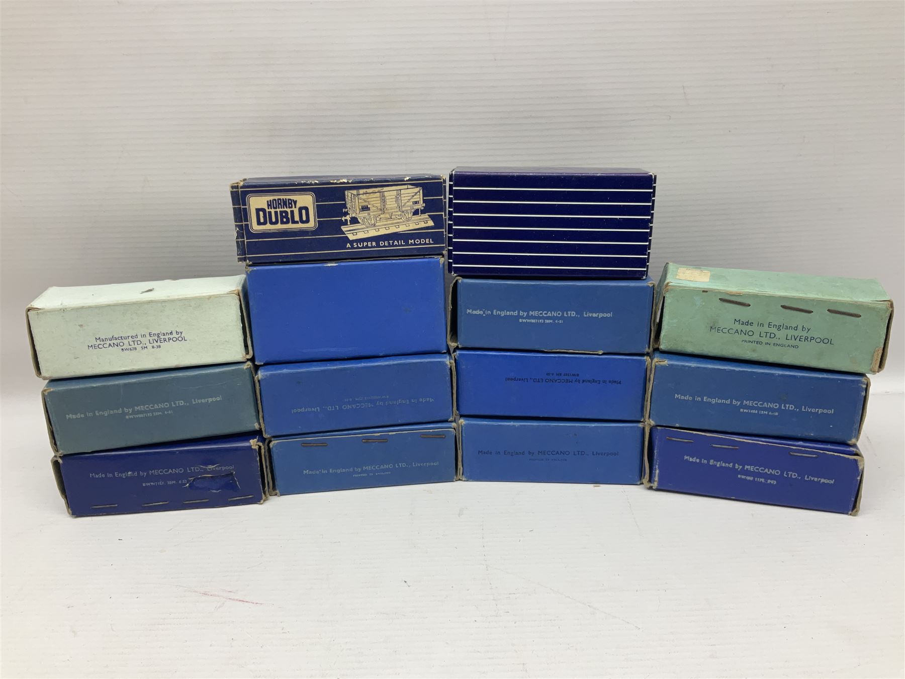 Hornby Dublo - nineteen goods wagons comprising 32040 Goods Van D1 (SR) in LMS stickered box, DR375 Goods Van D1 (GW), D303 Open Goods Wagon D1 (GW), 32044, 32076, 32052, 32021, 32074, 32056, 32065, DR379, 32070, 32020, DR373, two x 32075, High Sided Wagon D2 (LMS) in NE stickered box; all boxed; Tank Wagon D1 (Esso) and DR380 Meat Van D1; both in later unassociated boxes (19)