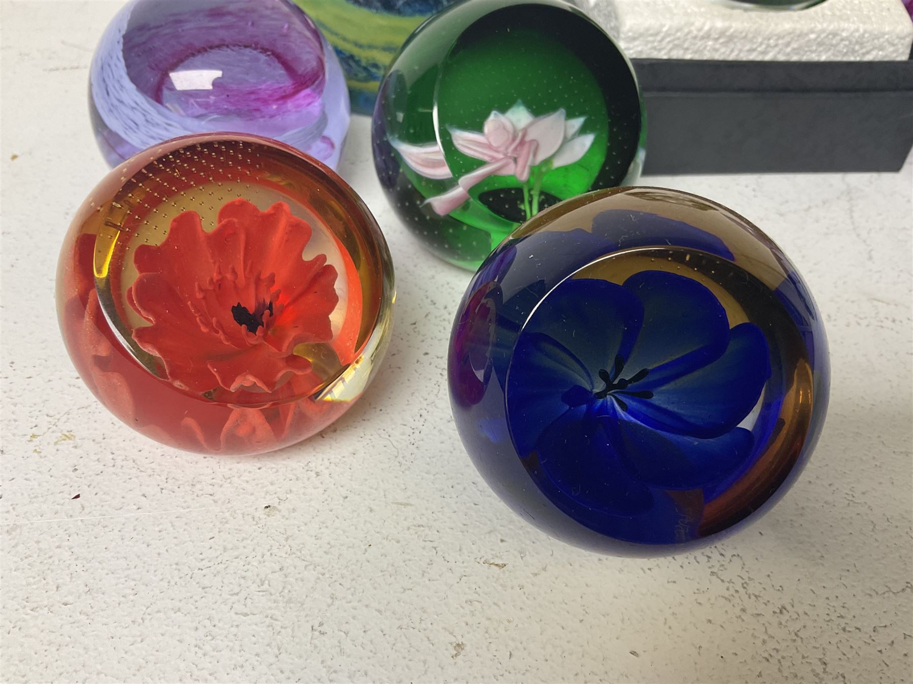 Twelve Caithness glass paperweights, to include Pastel, Mooncrystal and Fiesta, together with Baccarat 'The Princess Anne' paperweight and two Mdina examples (15)