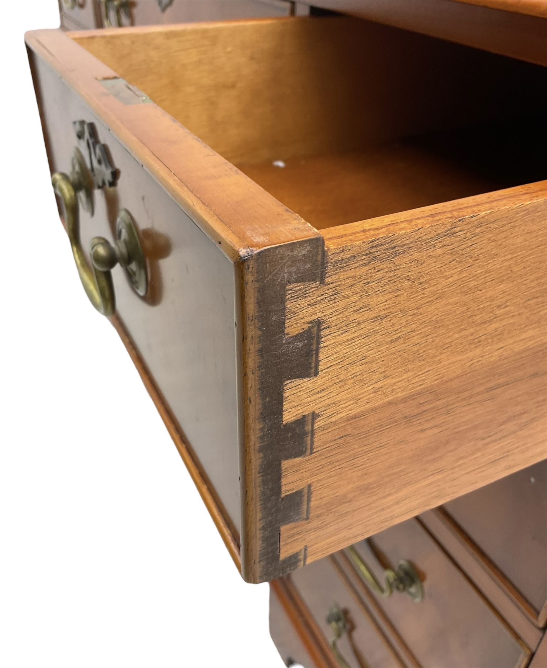 Georgian design yew wood twin pedestal desk, rectangular top with green leather inset writing surface, fitted with nine cock-beaded drawers, on bracket feet