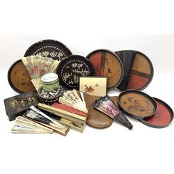 A group of assorted collectables, to include a selection of Vintage and later fans including ivory mounted examples, two Eastern circular mother of pearl inlaid trays together with a matching box and cover, a papier-mâché box, the hinged cover decorated in gilt with figural scene, etc. 