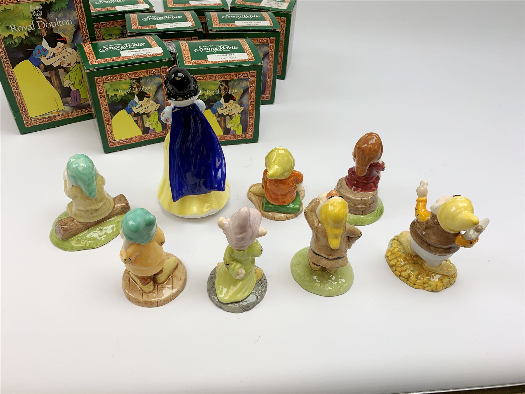 Royal Doulton Snow White and the Seven Dwarfs figurines, each with box. (8). 