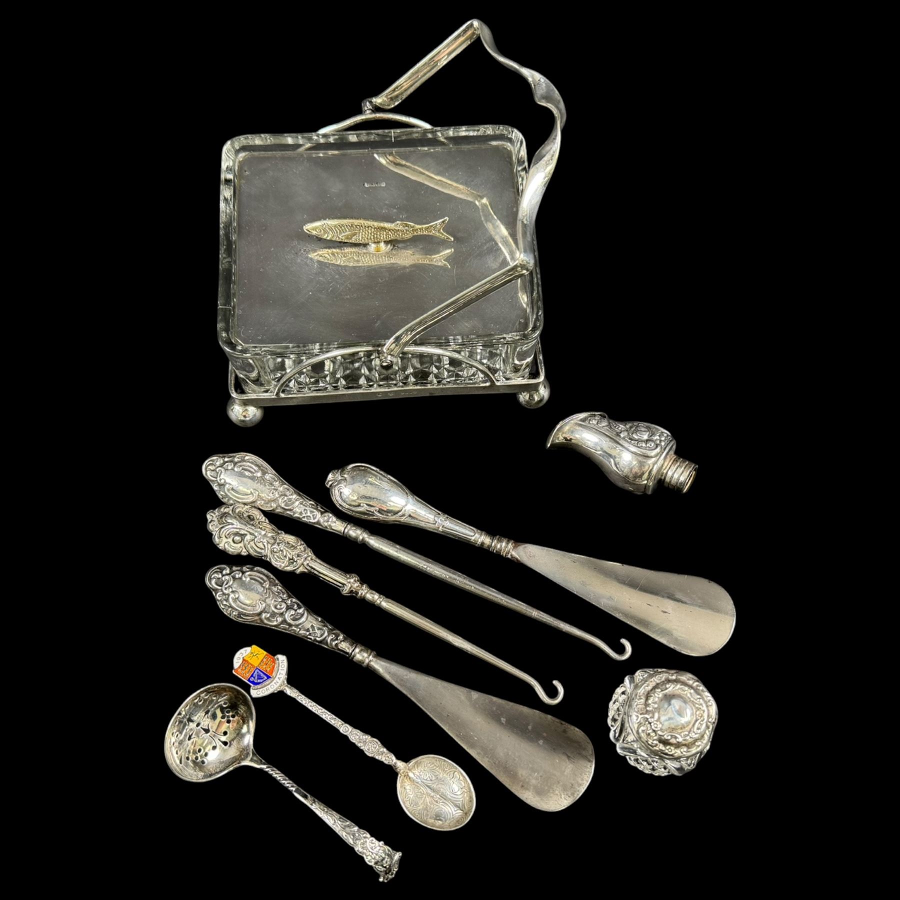 Silver handled button hooks and shoe horns, cut glass jar with silver lid, two silver spoons and an EPNS glass serving dish 