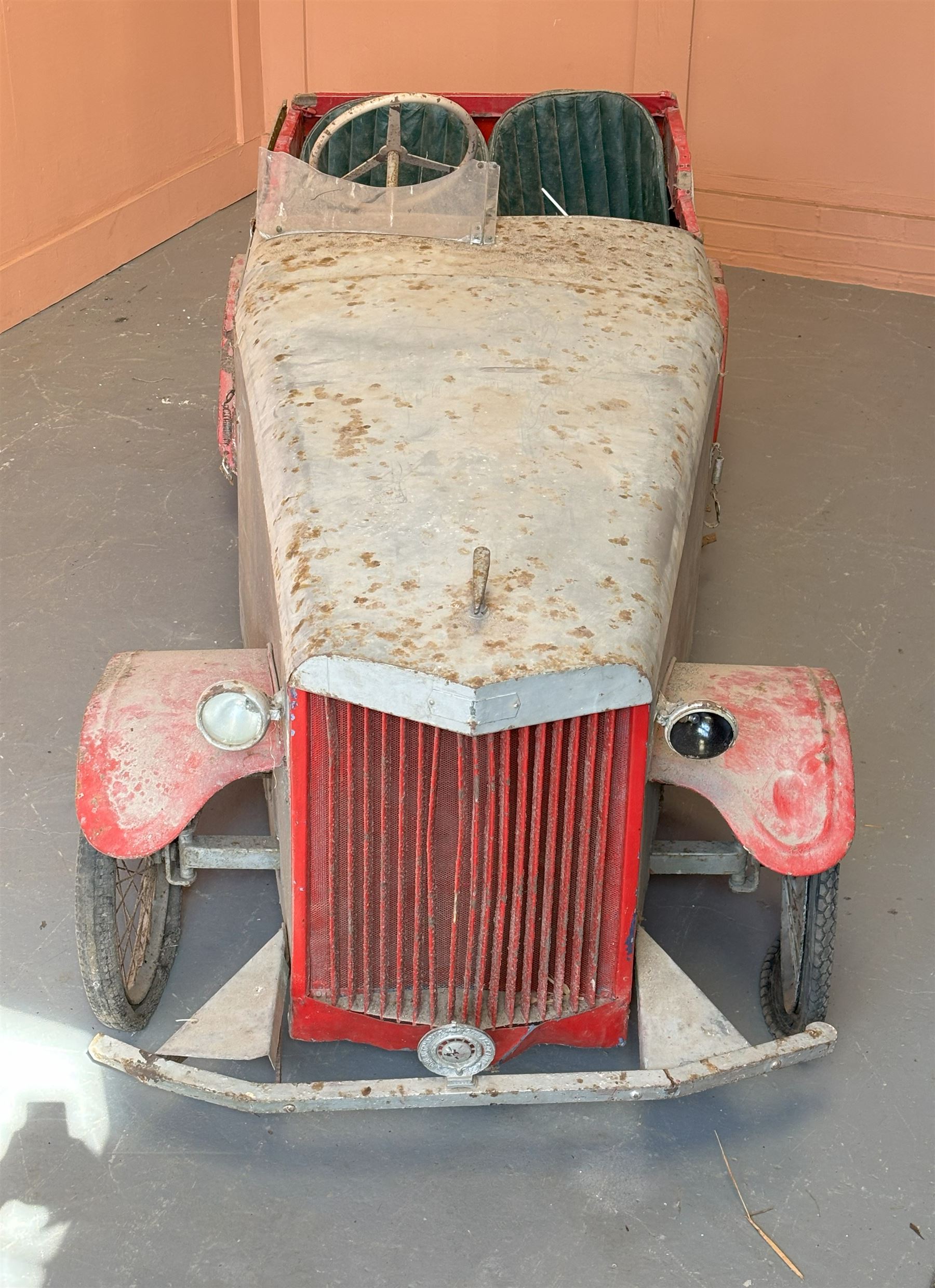 1930's open top two seater electric cycle sports car, in barn find condition, powered by 12v batteries and an electric motor. N.B. There is photographic evidnce to suggest this car was previosuly road registered with 'DMT8' liscence plate. L270cm, W100cm.  - COLLECTION BY APPOINTMENT FROM: The White House, Thirsk Road, Easingwold, York, YO61 3NF - CALL 01723 507111 TO ARRANGE