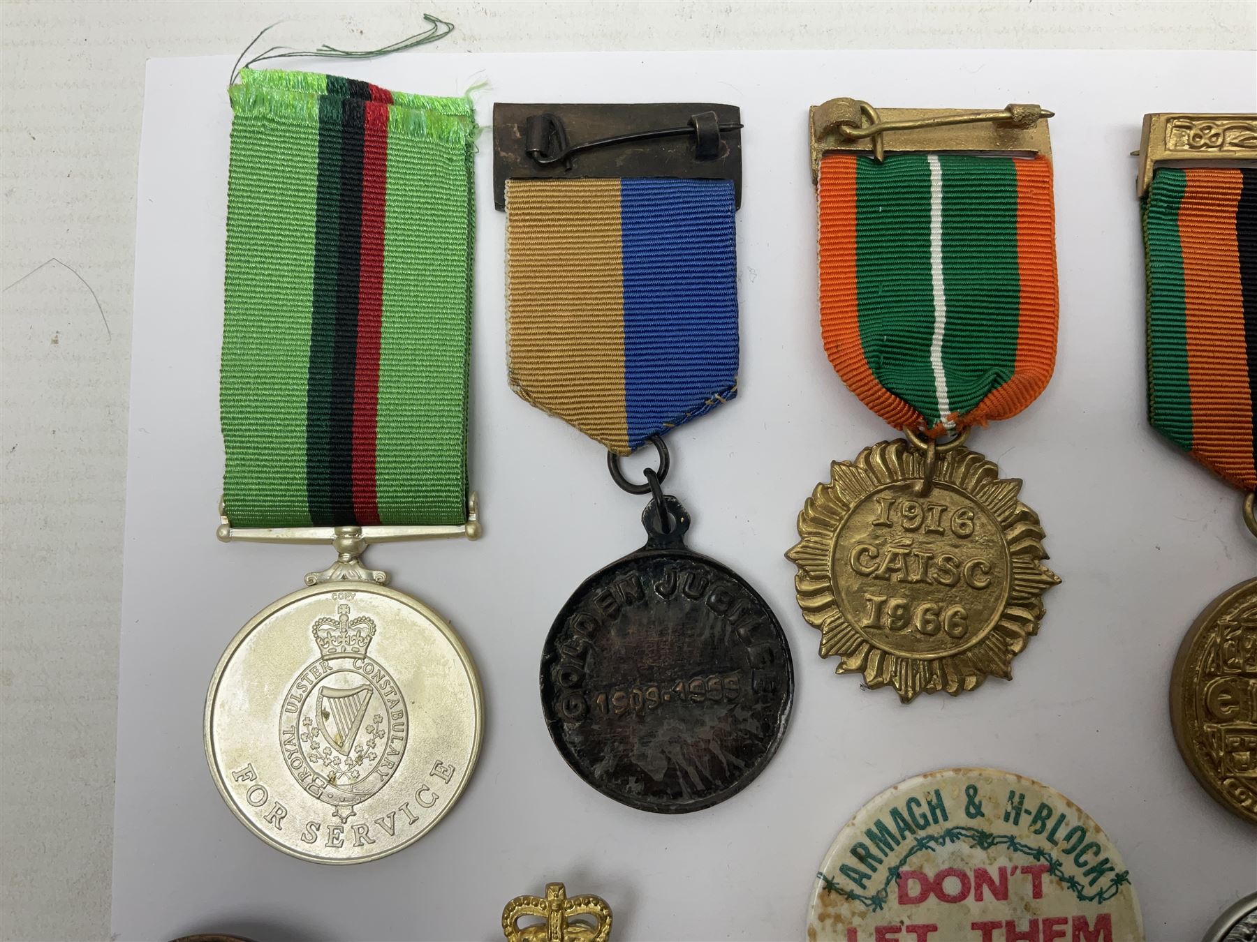 Small collection of Irish related medals, cap badges, buttons, political pin badges etc