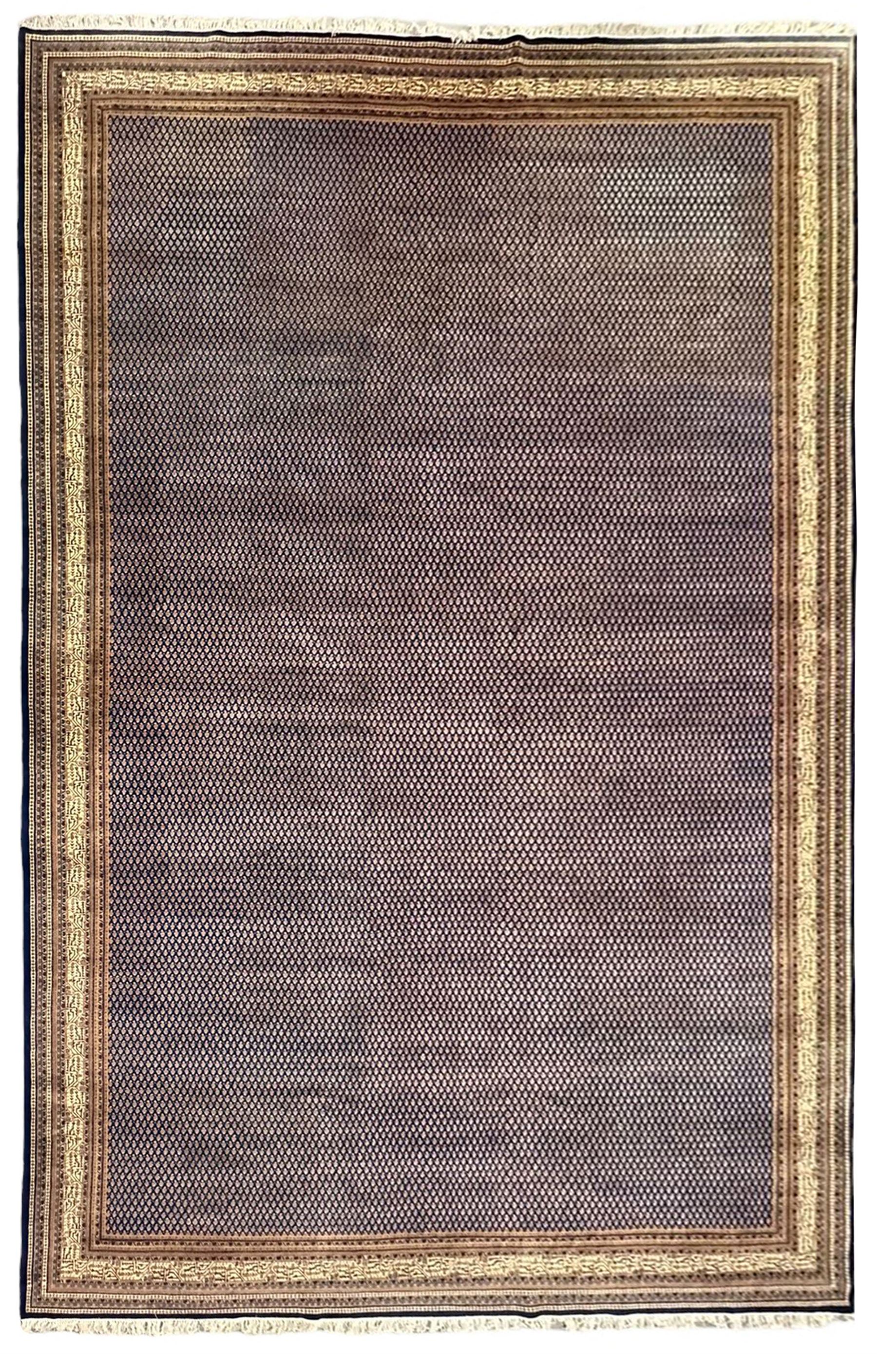 Large North-West Persian Arrak indigo ground carpet, the field decorated all-over with small Boteh motifs, multiple band border decorated with repeating geometric designs 