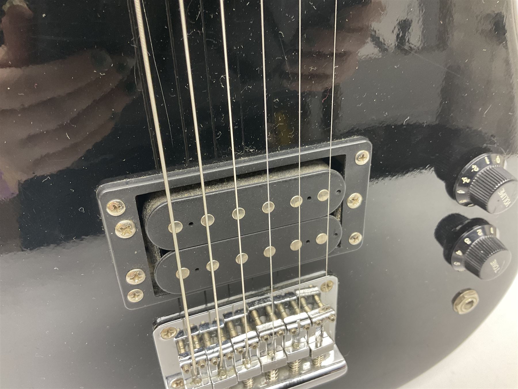 Encore black electric cut-away guitar L96cm; and Spanish Victor Garcia model 187 acoustic guitar, bears label dated 1972 L99cm; each in soft carrying case (2)