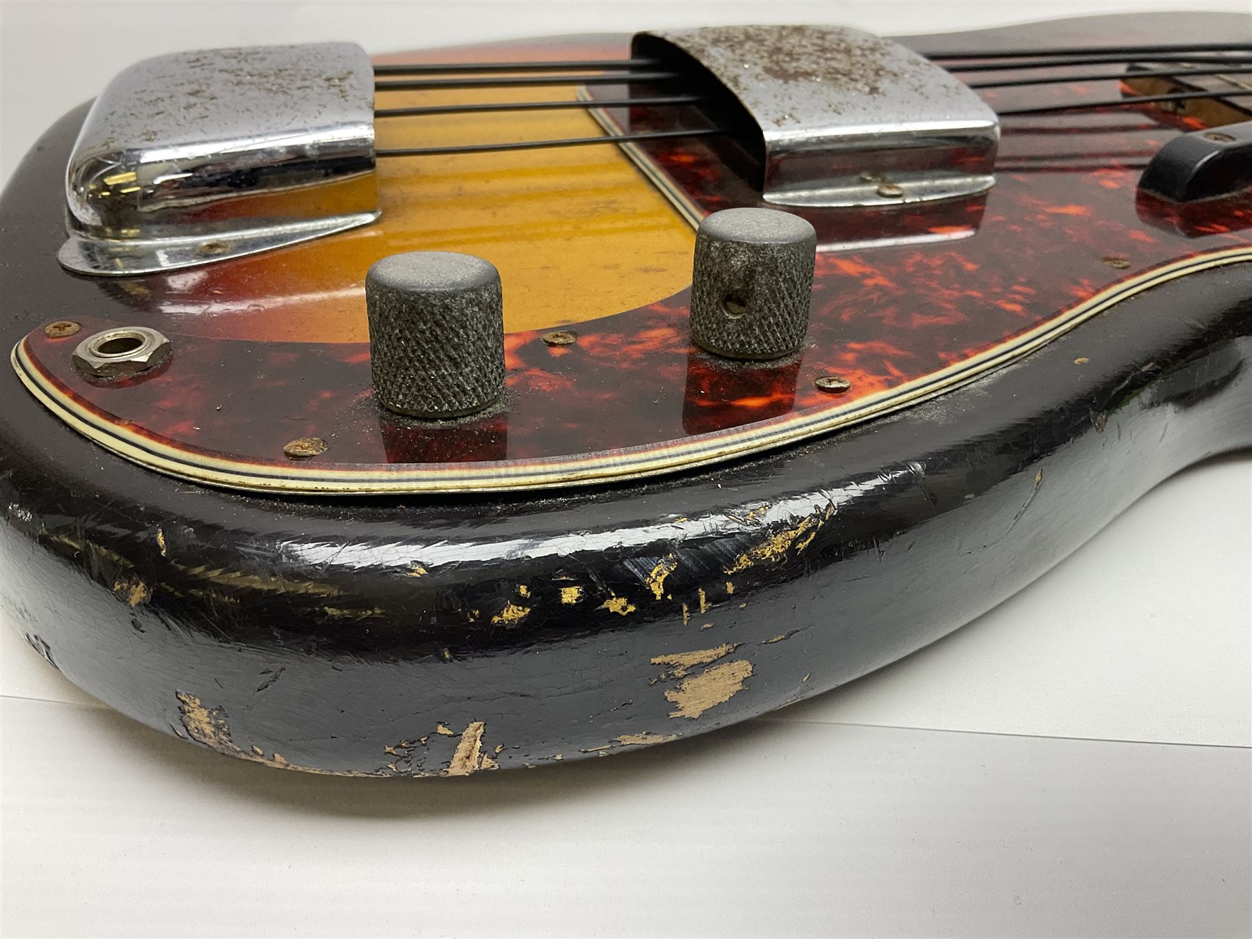 Early 1960s American Fender Precision electric bass guitar with original three-tone sunburst finish and faux tortoiseshell scratch plate; rosewood fretboard; all original fittings including chromium plated bridge and pick-up covers, finger rest, 'pots' and machines, dated on end of neck 5NOV62C, serial no.91625; L115cm overall; in Selmer simulated reptile skin covered carrying case. Sold with non-transferrable CITES A10 licence, certificate no.23GBA10CNKKEB, serial no.441200, dated 30th August 2023. Also included are original 1960s photographs of the band 'The Rascals' and photocopies of newspaper cuttings advertising their forthcoming performances along with a photocopy of a photograph of their television appearance on 'Opportunity Knocks' in 1967/8 (coming second to Mary Hopkins). In addition there is a reel-to-reel tape recording and USB stick of the band playing and two sheets of biographical information. Auctioneer's Note: The guitar was ordered by Trevor Parker from Pat Cornell's Music Shop, Spring Bank, Hull and imported from the USA in 1962, well before it was available in the UK. Trevor was the bass guitarist of The Rascals from Hull, later The Ides of March, who supported artists such as Elton John on the Hull circuit. Trevor played the guitar extensively until 1969 when The Rascals disbanded, he got married to Maureen and settled down to family life. Trevor sadly passed away in 2017, and after being in store for fifty-four years his widow has decided it is time for his guitar to be sold.