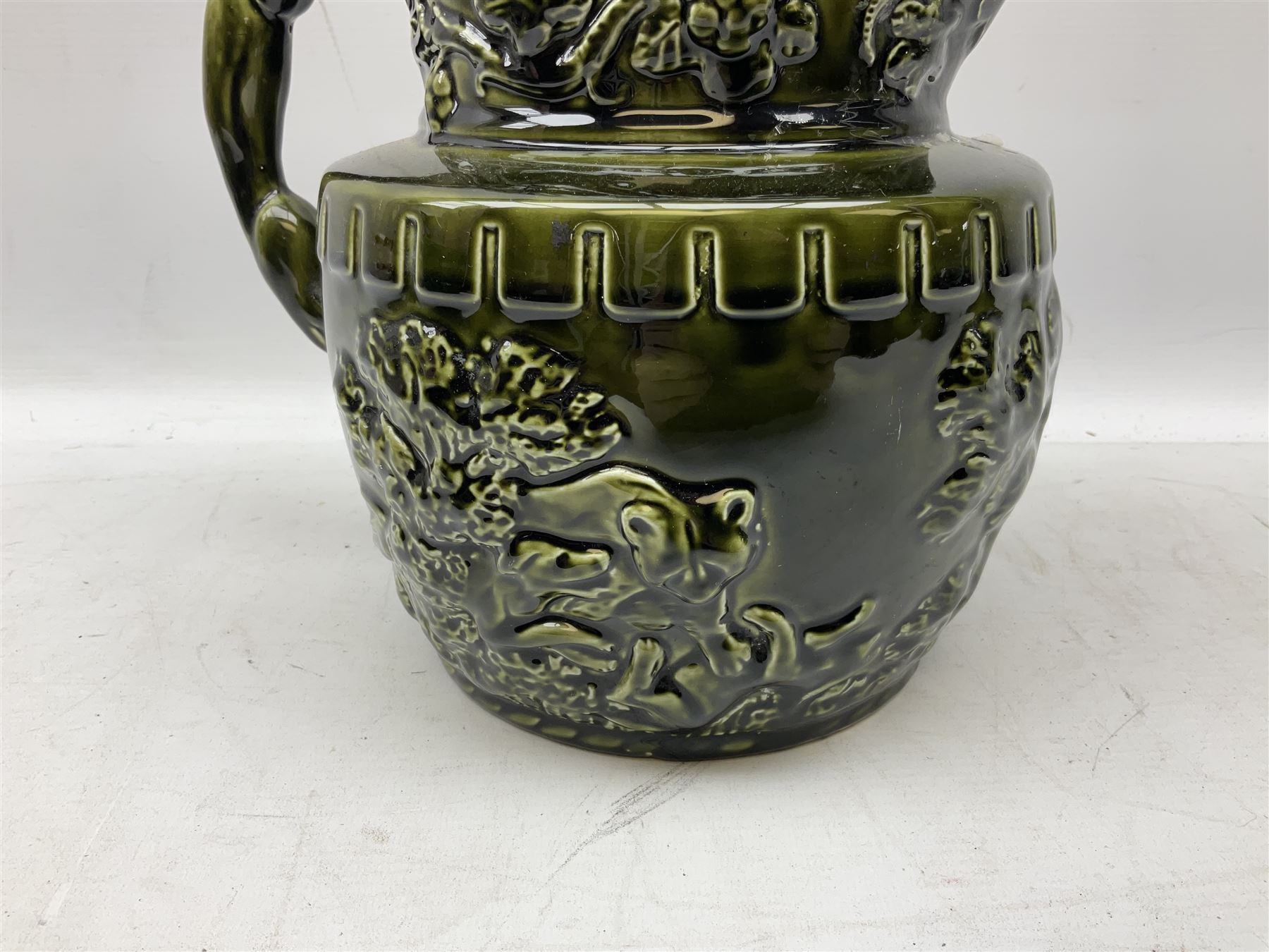 Three jardinières comprising West German Gerz example decorated in relief, Doulton Slaters example with frilled everted rim and a majolica example, and a further two Arthur Wood majolica jugs (5)