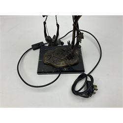 Art Nouveau style lamp in the form of a woman on a swing, with a green mottled shade, upon a marble base H52cm