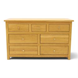 Contemporary light oak chest, rectangular top fitted with three short over four long drawe...