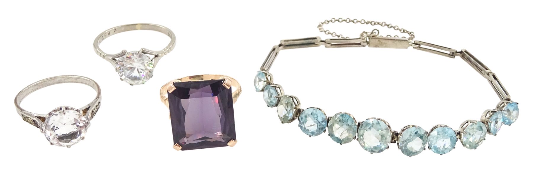 Early 20th century silver blue zircon bracelet, 12ct gold synthetic alexandrite ring, white gold paste stone set ring, stamped 18ct and a silver paste stone set ring
