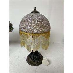 Art Deco Tiffany style table lamp, modelled as a dancer with a fan shaped shade, together with another table lamp with mottled glass and tassel shade, tallest H41cm