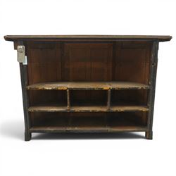 Arts & Crafts oak D-shaped bar, moulded edged counter above a front with velvet applied panels, the back with shelving, raised on a plinth base