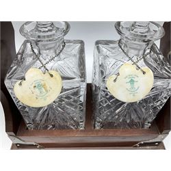 Late 20th century mahogany and silver plated two cut glass decanter tantalus, marked PB&S, with Whisky and Gin Crown Staffordshire ceramic decanter labels, H32cm