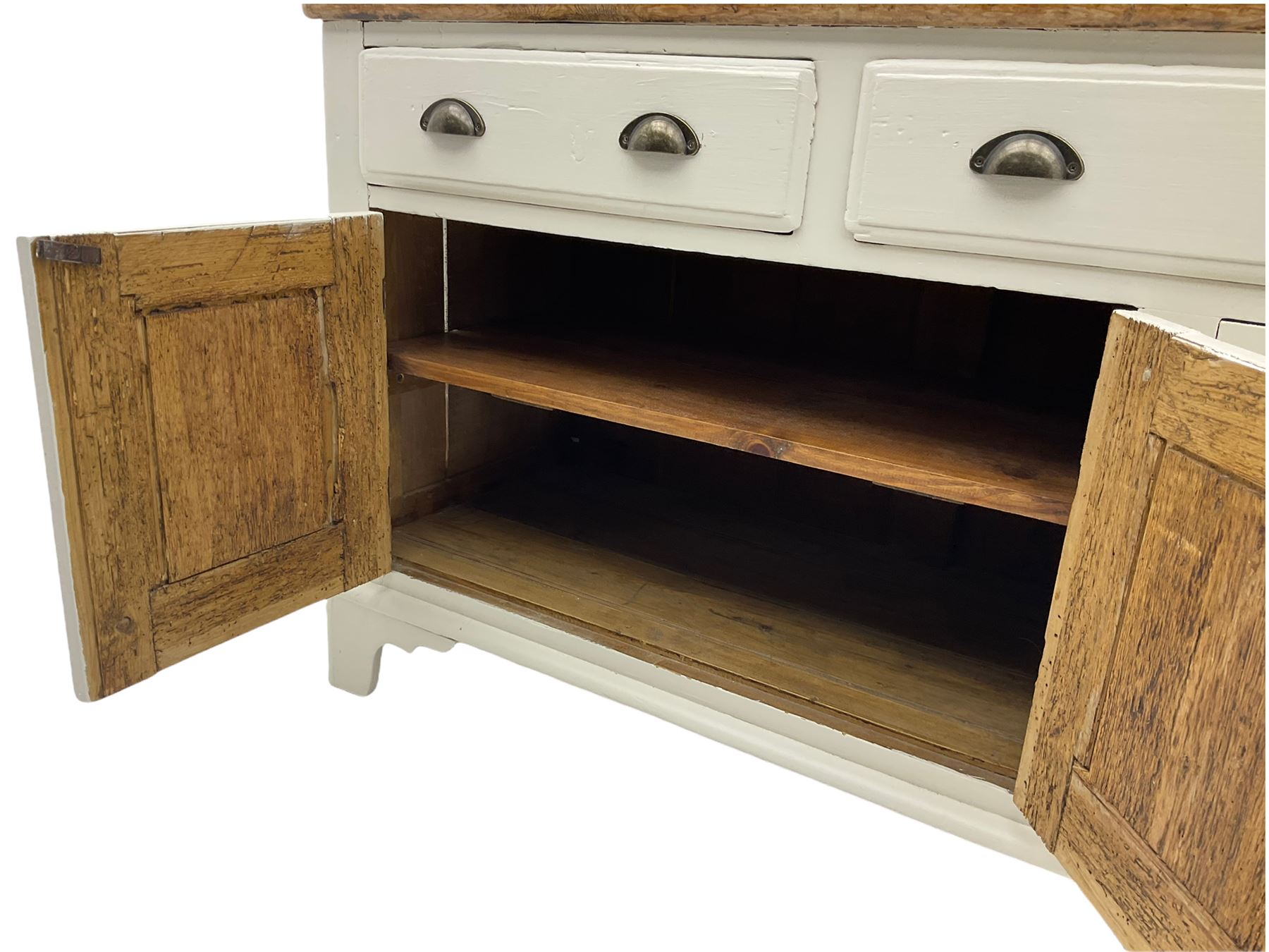 Victorian pine dresser, raised painted three heights plate rack with projecting cornice, waxed top over pained base fitted with three drawers and two double cupboards, bracket feet