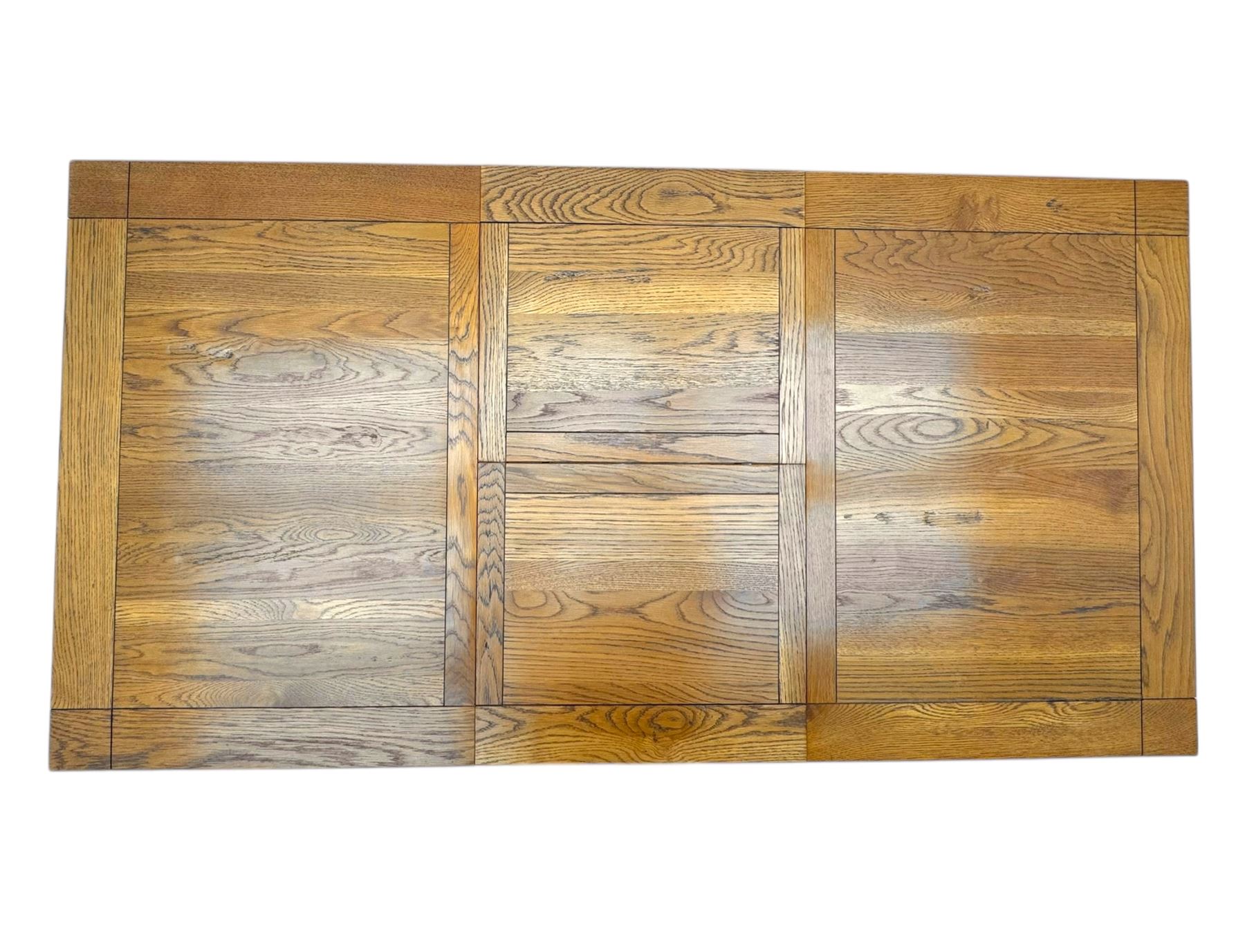 Contemporary oak dining table, rectangular panelled top with integral extension leaf, raised on square supports; set of four oak ladder-back chairs with padded brown seats