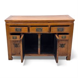 Late 20th-century Thai elm sideboard fitted with an arrangement of three drawers over a central cupboard flanked by a further two drawers, raised on square post feet 