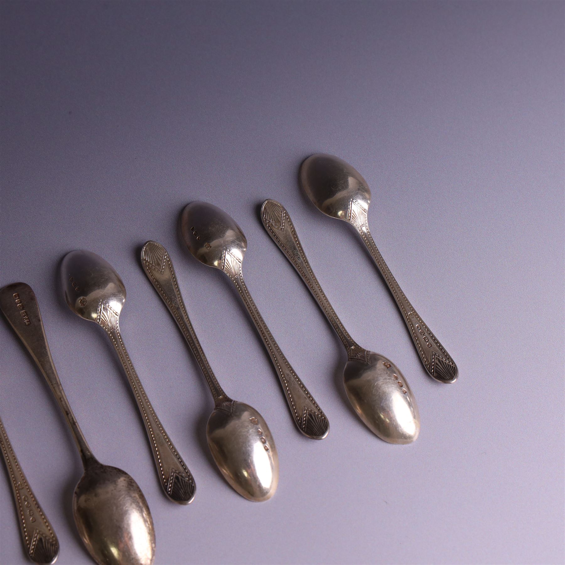 Set of ten silver late Victorian silver teaspoons, with beaded rimg and engraved fan design, hallmarked Thomas Bradbury & Sons, London 1891, and a set of five Victorian silver teaspoons with beaded rim, hallmarked Thomas Prime & Son, Birmingham 1890