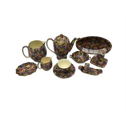 Ten pieces of Grimwades 'Hazel' pattern chintz ware, comprising teapot, jug, smaller jug, dishes of various size and form, teacup and saucer, sugar sifter, and pepperette 