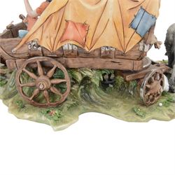 Capodimonte figural group of a gypsy encampment including wagon, cooking fire and people, H21cm