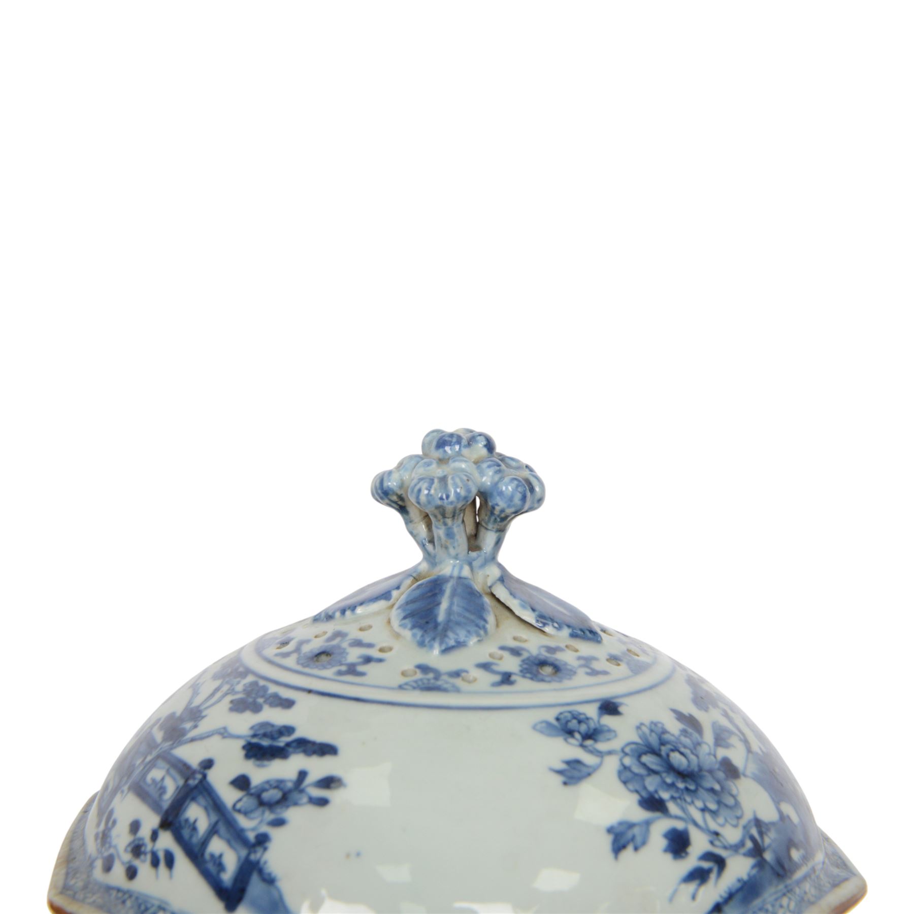 Late 18th/early 19th century Chinese export blue and white tureen and cover, the body with twin curved handles, the pieced and domed cover with multi flower head finial, painted with peonies, rockwork, and fences, overall H26.5cm D22cn 