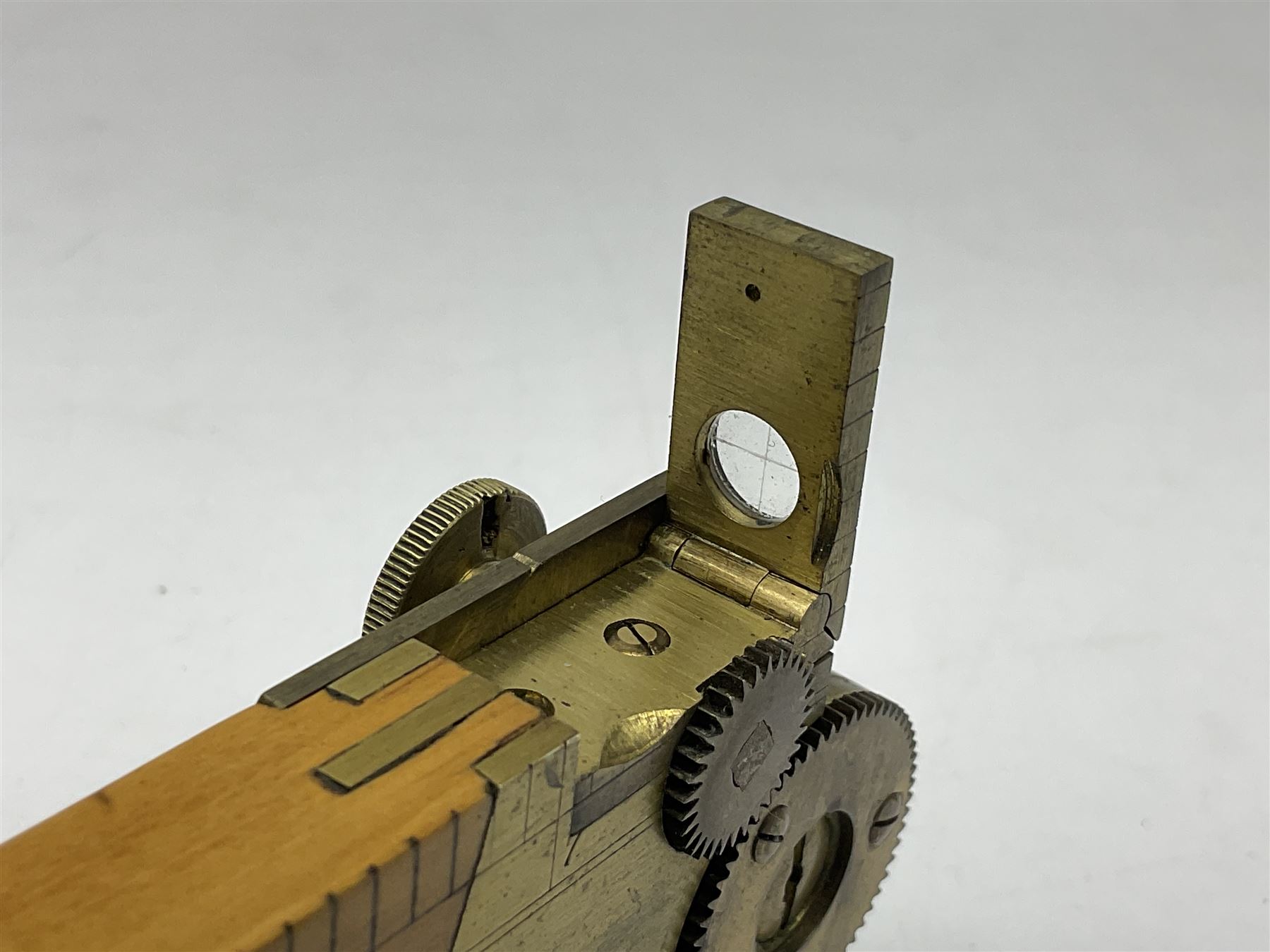 Late 19th/early 20th century boxwood and brass clinometer rule by Stanley, with inset magnetic compass, screw action protractor hinge divided to one degree with rise in inches per yard scale under, spirit level to one edge, marked 'W.F. Stanley Great Turnstile Holborn' with tables of distances, angles and thickness H16cm closed: in original leather covered case with instructions