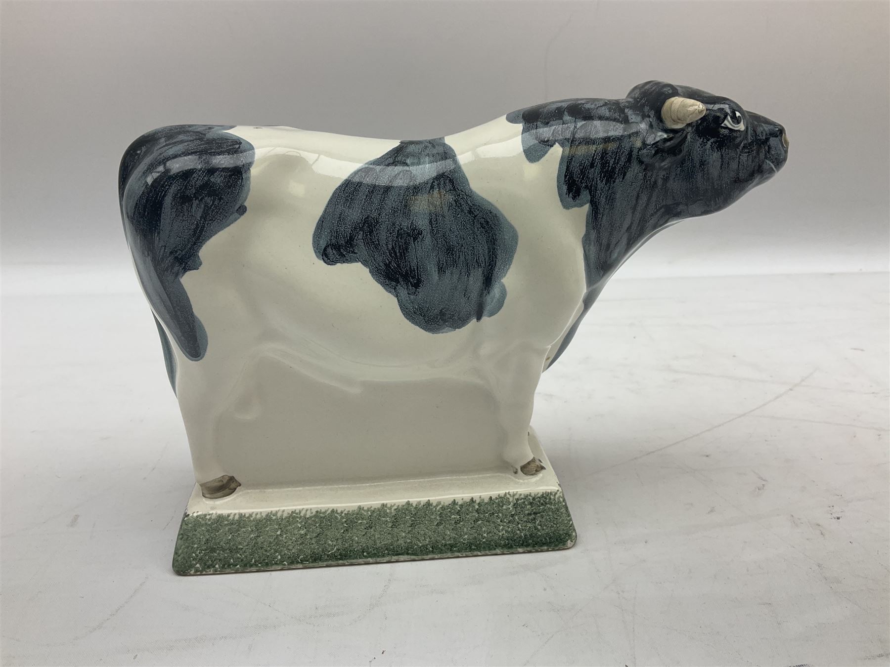 Six Rye Pottery figures, comprising, jumping fox, squirrel upon a branch, billy goat, bull, chicken and cockerel  