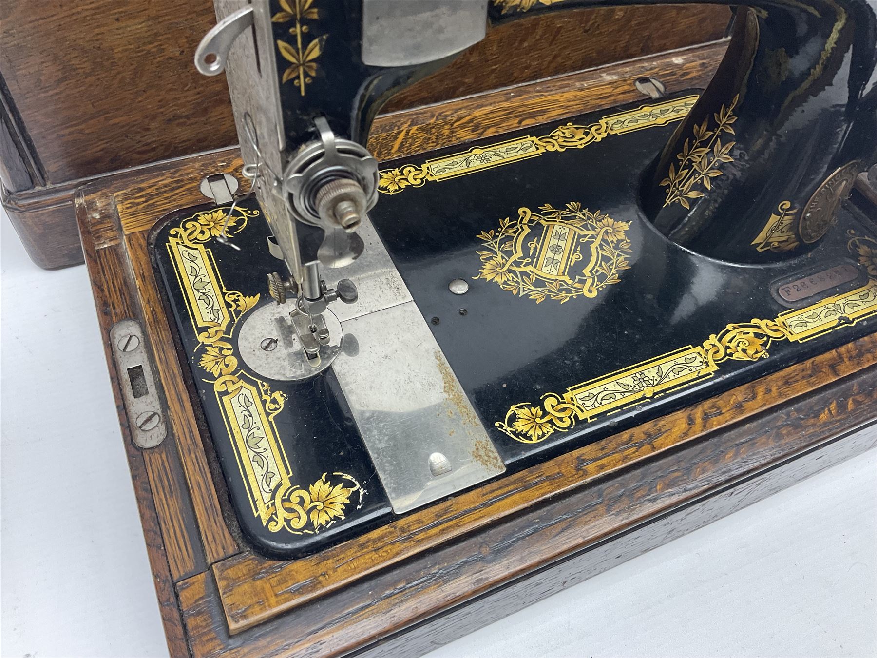 Singer 66 sewing machine in wooden case, together with an LG DVD player with speakers, two portable DVD players, etc 