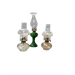 Pair of oil lamps, with impressed mark beneath Farms Lamp Light, together with another oil lamp and two lanterns  