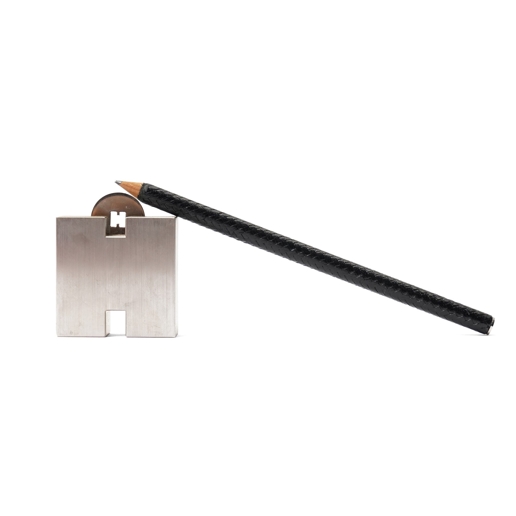 Hermès - ‘H’ pencil sharpener, brushed palladium-tone metal, with black leather-covered pencil, two original boxes and booklet