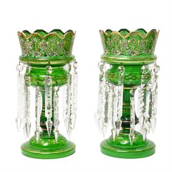 Pair of Victorian green glass mantle vases decorated with flowers in gilt and hung with sp...