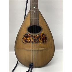 Late 19th/early 20th century Italian lute back mandolin with segmented back and spruce top; bears maker's label for Pietro Tonelli Napoli; together with a mandolin instruction booklet and a folding music stand L60.5cm