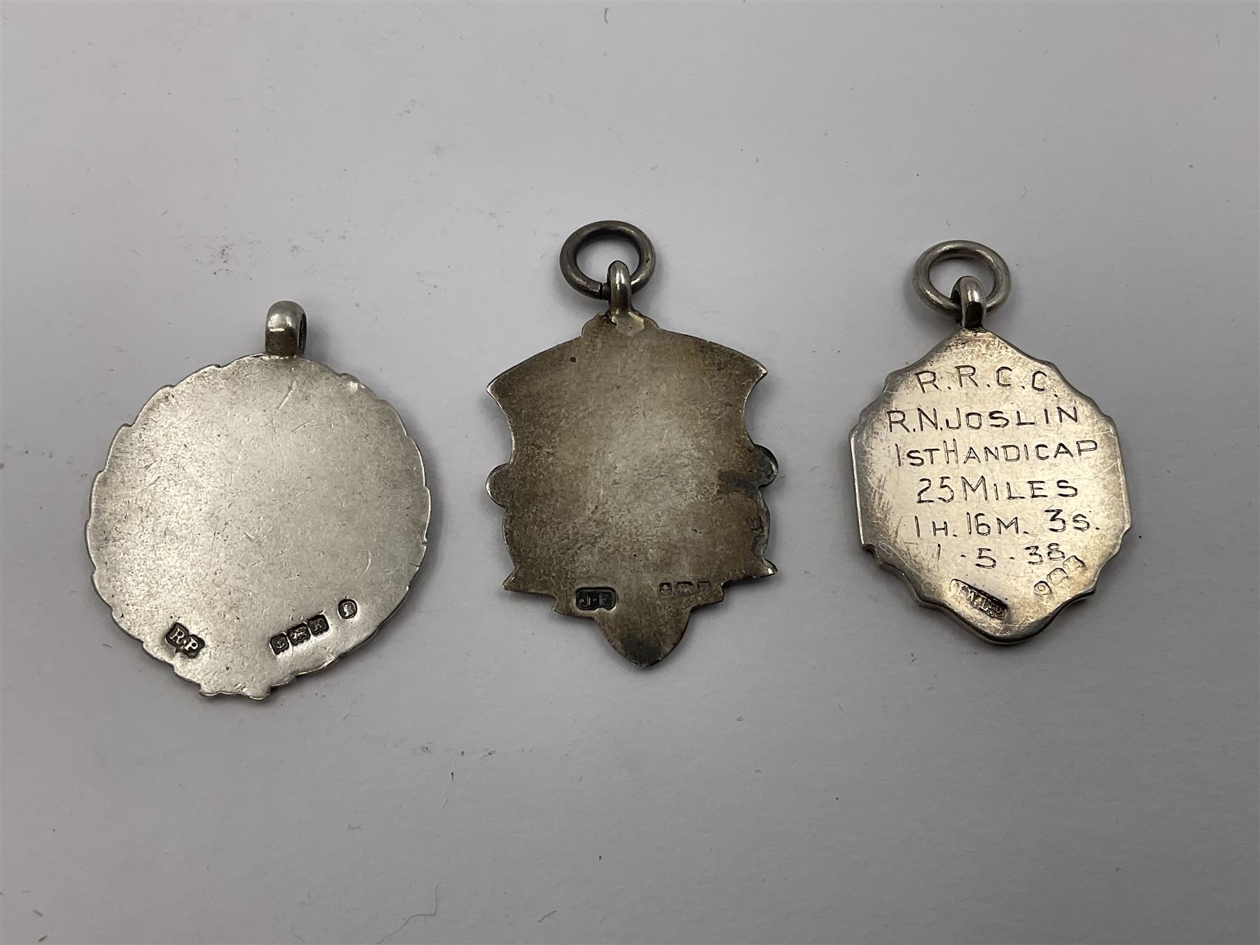 Ten early 20th century silver cartouche fobs, to include a Yorkshire Rose example, all hallmarked with various dates and makers
