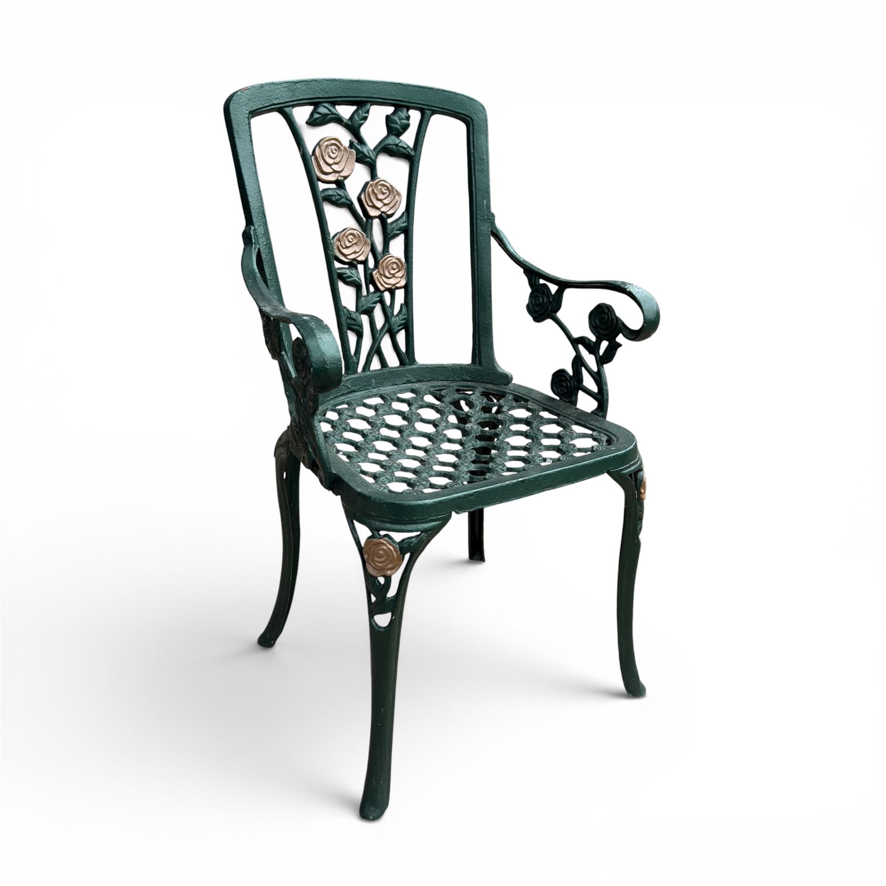 Cast aluminium oval garden table and set of four armchairs with pierced rose design back splats