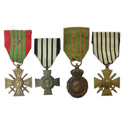Four French medals - St. Helena medal with bust of Napoleon to obverse and inscription to reverse 'Campagnes de 1792 a 1815. A ses compagnons de gloire sa derniere pensée Ste. Hélène 5 Mai 1821', established by Emperor Napoleon III in 1857; two WW2 Croix-de-Guerre; and WW2 Croix-du-Combattant; all with ribbons (4)