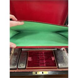  Victorian brass inlaid rosewood dressing table box, retailed by F.L. Hausburg, Liverpool, the lid centred by a brass cartouche, opening to reveal letter store to lid underside, above a fitted interior, with ten mounted cut glass jars, bottles and manicure set, within lift out leather trays, above jewellery drawer, with key, H17cm D24cm