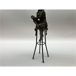 Art Deco style bronze modelled as a female figure, holding her knee, seated upon a chair, after 'Pierre Collinet', H28cm