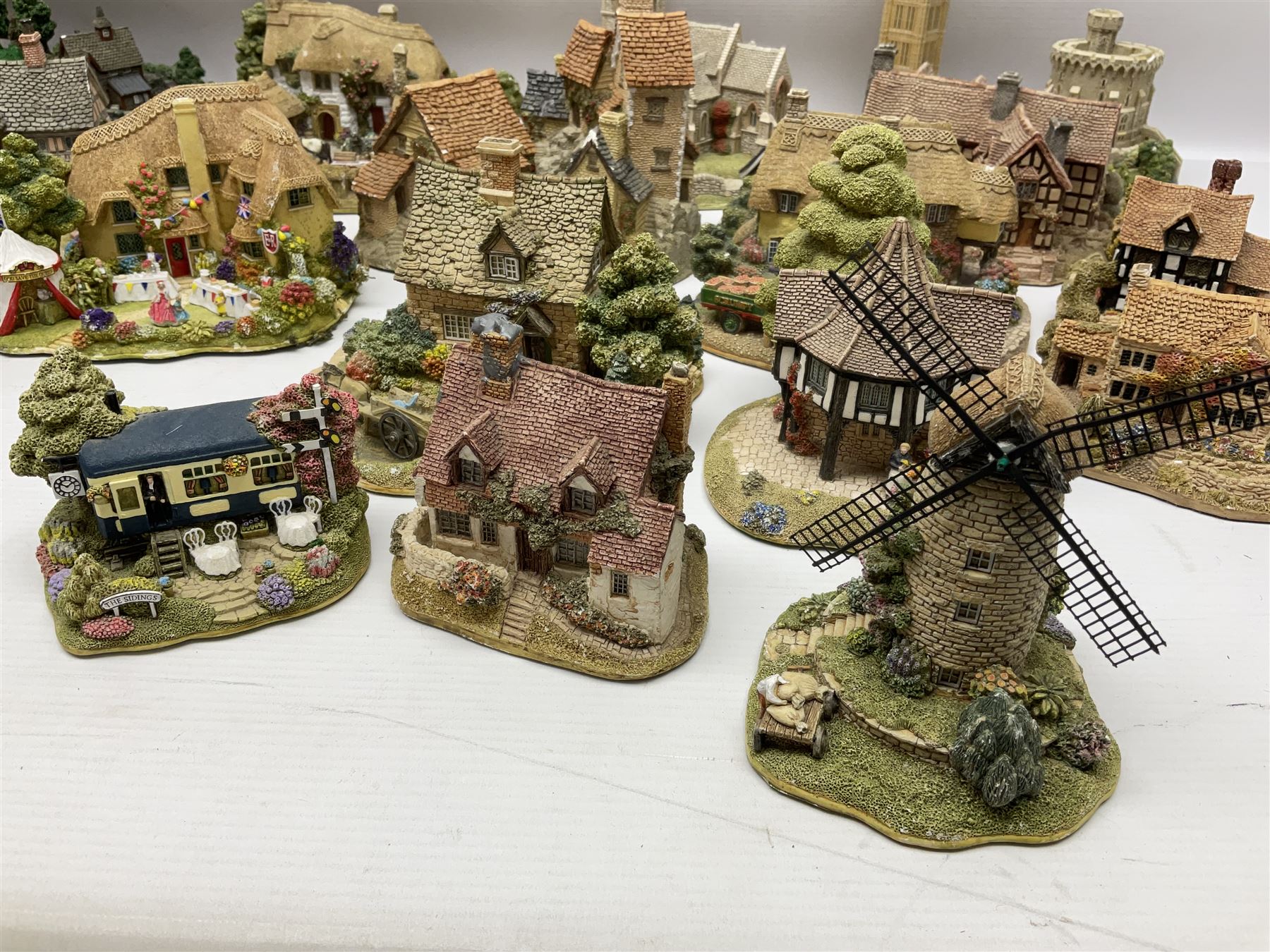 Twenty six Lilliput Lane models, to include Golden Harvest, Junk and Disorderley, Heaven Lea Cottage, Old Scrumpy Farm, Chantry Chapel Wakefield, etc, together with four similar cottages