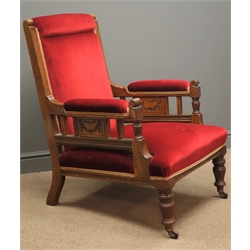  Edwardian oak armchair, moulded uprights, sides carved with swags, upholstered in red velvet, on turned reeded supports, W70cm  