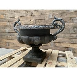 Victorian design ornate cast iron centrepiece urn, featuring two handles, raised on footed base