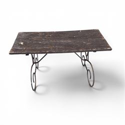 Cast iron garden table, with rectangular weathered slatted wooden top, raised on iron strapwork supports of scrolling form, in black painted antique finish 