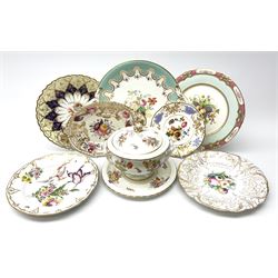 A 19th century Coalport tureen and stand, decorated throughout with floral sprays and sprigs and heightened with gilt, with printed marks beneath, retailed by Soane & Smith, together with a Chelsea style cabinet plate hand-painted with an exotic bird and flowers, with spurious gold anchor mark beneath, a Spode Felspar porcelain stand with painted and moulded decoration of roses, thistles, and shamrocks emblematic of the Union, an early 19th century floral painted stand, of oval form with Crown moulded handles, L25cm, plus three further cabinet plates, two examples in the style of Minton. 