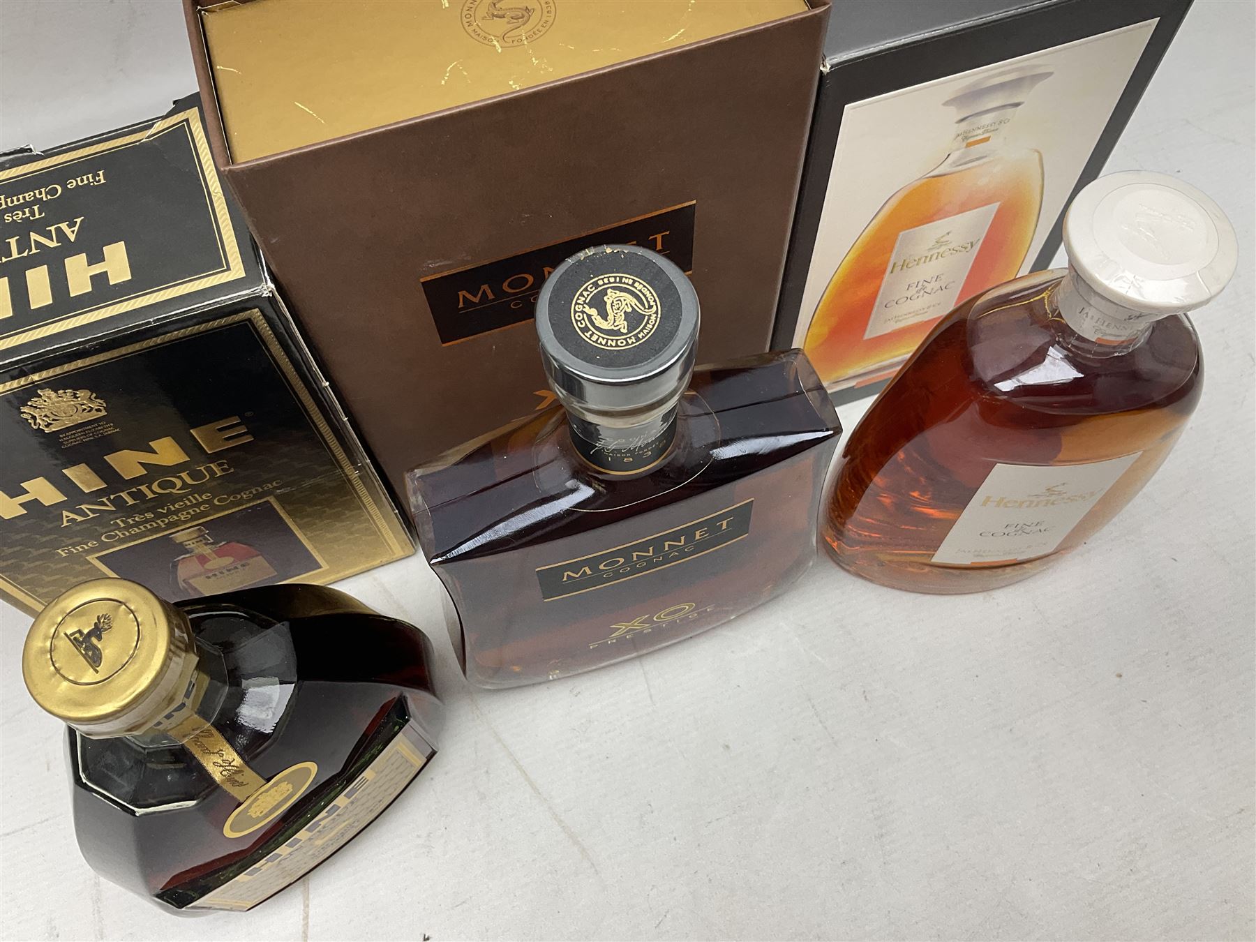 Hennessy, fine de cognac, 70cl, 40% vol, Monnet, Xo prestige cognac, 70cl, 40% proof and Hine Antique, Tres Vieille champagne cognac, 68cl, 40% vol, all with original boxes 