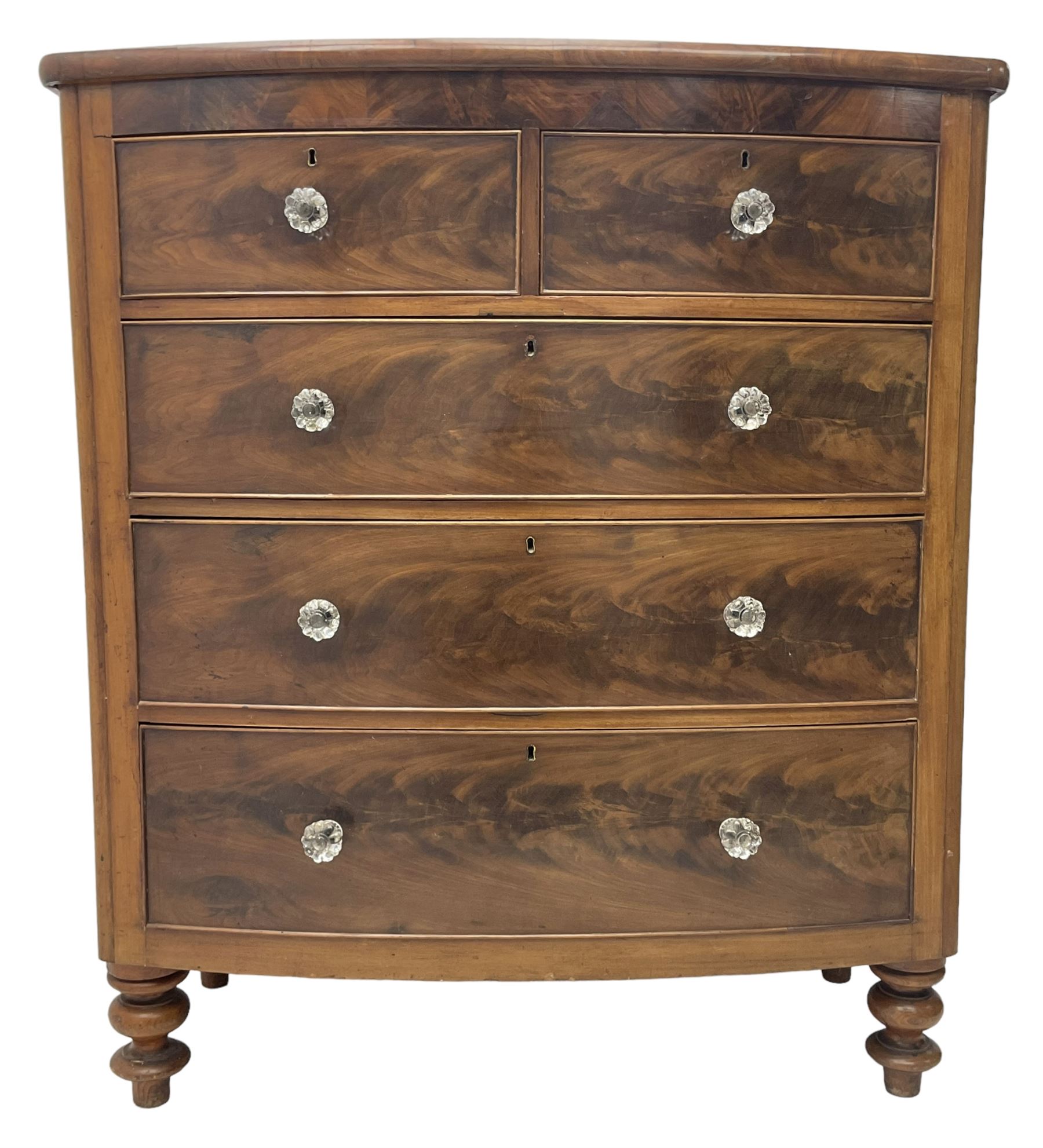 Victorian mahogany bow front chest, fitted with two short over three long graduating cock-beaded drawers, each with glass handles, raised on turned feet